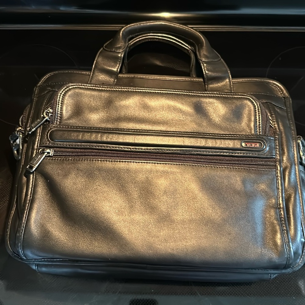 Tumi black leather briefcase